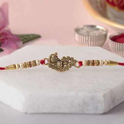 Golden Peacock Rakhi and Roli-Chawal Set