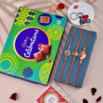 Om & Peacock Rakhi with Cadbury Celebrations combo